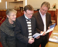 Parishioners of St Andrew Glencairn studying the Organ Donor leaflets in church on November 30.